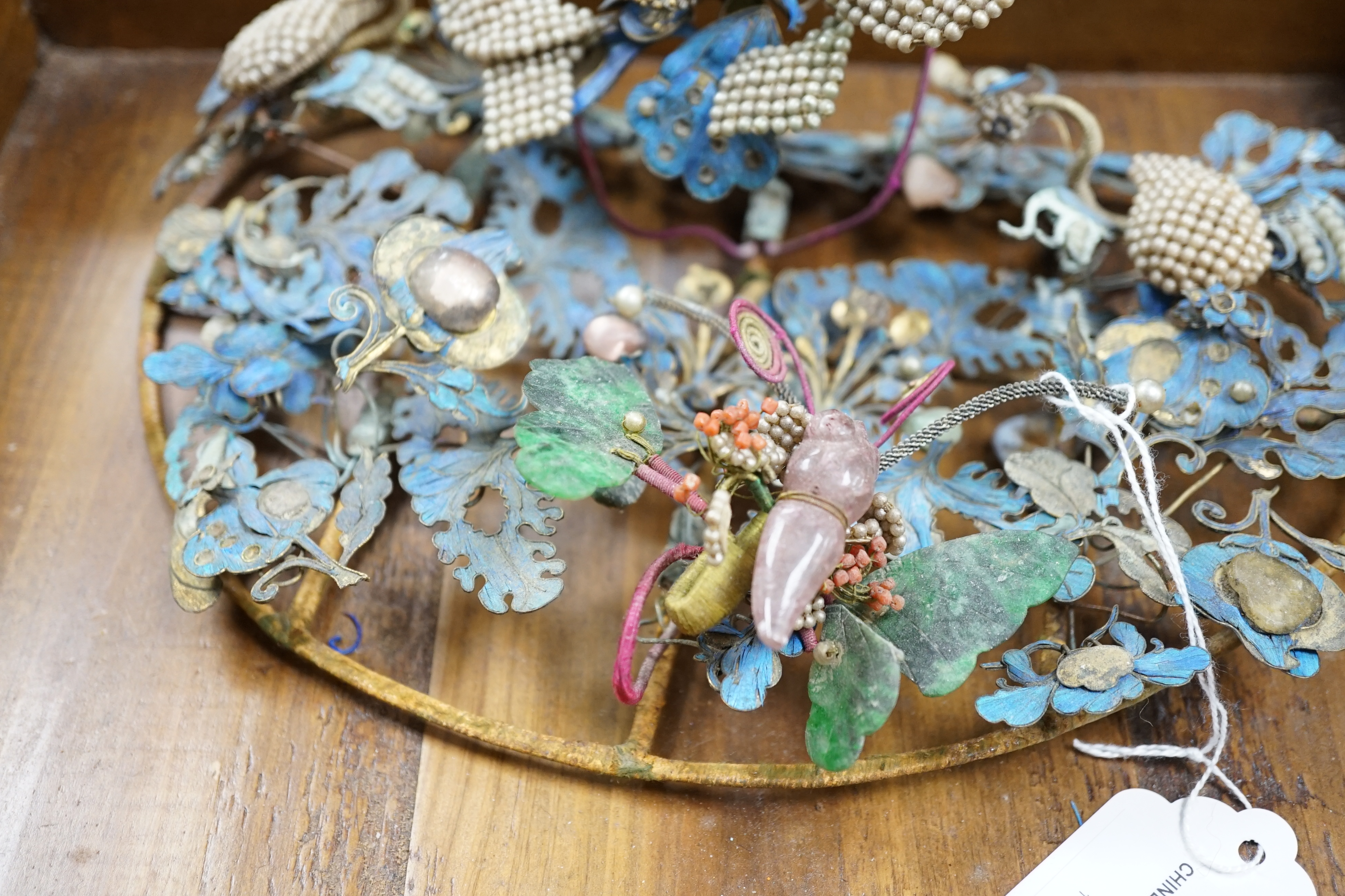 A group of eight Chinese kingfisher feather, jade, seed pearl, coral and hardstone mounted headdresses and ornaments, late Qing dynasty, some losses